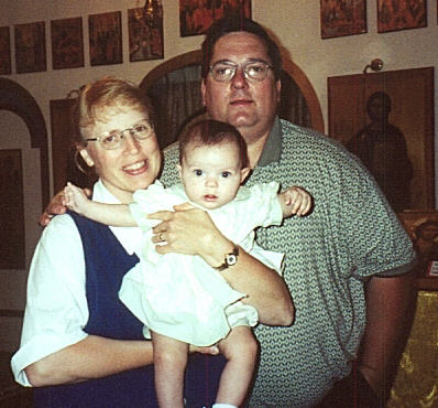 Anna with her delighted new parents on our first Sunday in church